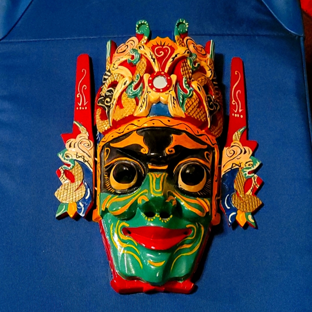Hand carved wood mask from The Great Wall in China. A great conversational piece